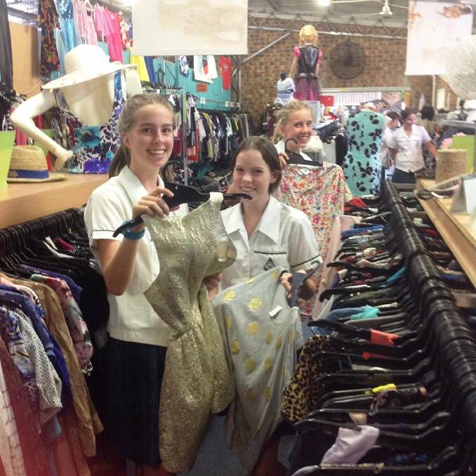 EXPLORE: Textile students searching the racks for different textiles to use.