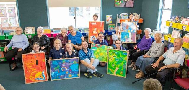 FUN: Students and aged care residents bond over a shared passion for art.