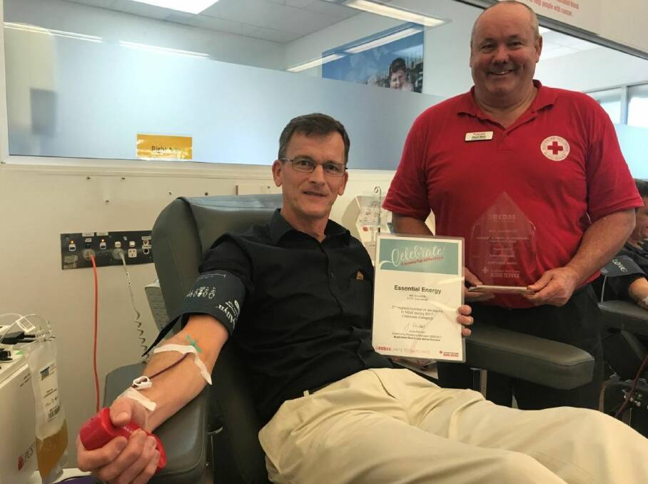 SAVING LIVES: Harry Pol and community relations officer Stuart Ward at the blood centre in Port Macquarie.