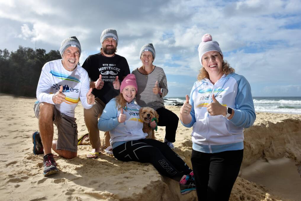 Thumbs up: Don Roach, David Mayes, Rinnie White, Gai Teale and Nicole Champion are helping raise money for the Mark Hughes Foundation by wearing their beanies in a running event this Sunday, June 18. 