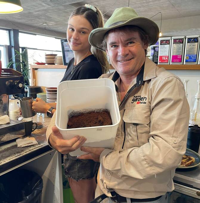 North Haven's Marty Ware collects coffee waste from Brewhaven staff member Myanna. 