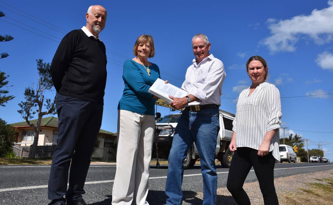 Ocean Drive petition: Lake Cathie residents Vern Warner, Garry Roberts and Donna Nairne give 300 signatures to acting mayor Lisa Intemann. 