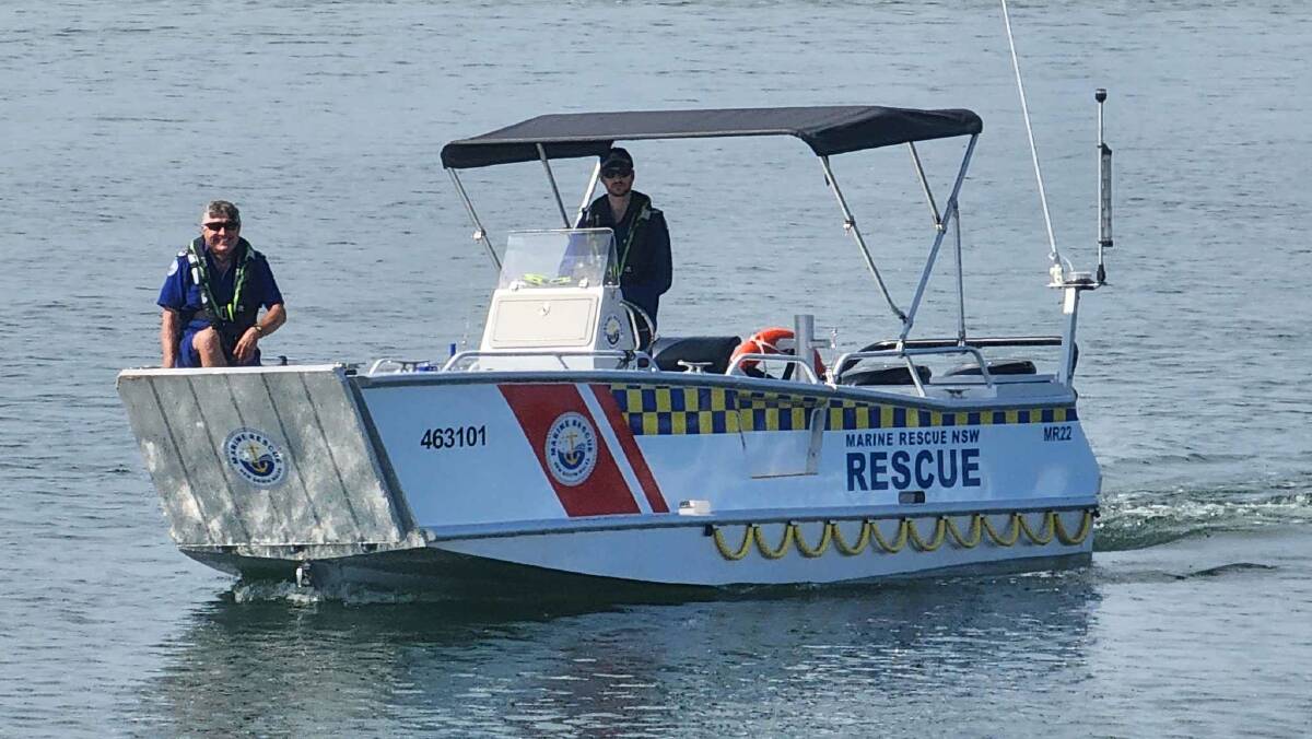 Marine Rescue Port Macquarie Unit's Chris Condon and Scott Saunders on the new Marine Rescue 22 vessel for its first job. Picture supplied by Marine Rescue Port Macquarie. 