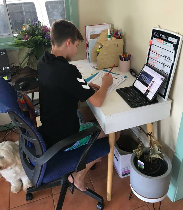 Working from home: Micah is a Year 6 student of Aspect Hunter Port Macquarie Satellite, which is based on the grounds of St Josephs Primary School. Photo: supplied. 
