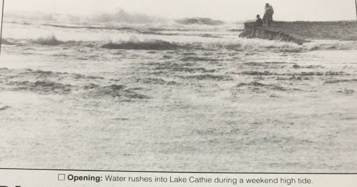Port News photo from December, 1994 when a big tide caused Lake Cathie to open naturally. 