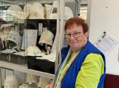 Port Macquarie & District Family History Society president Di Gillespie with the display of handmade bonnets to remember the women who came to Port Macquarie as convicts. Picture by Liz Langdale 