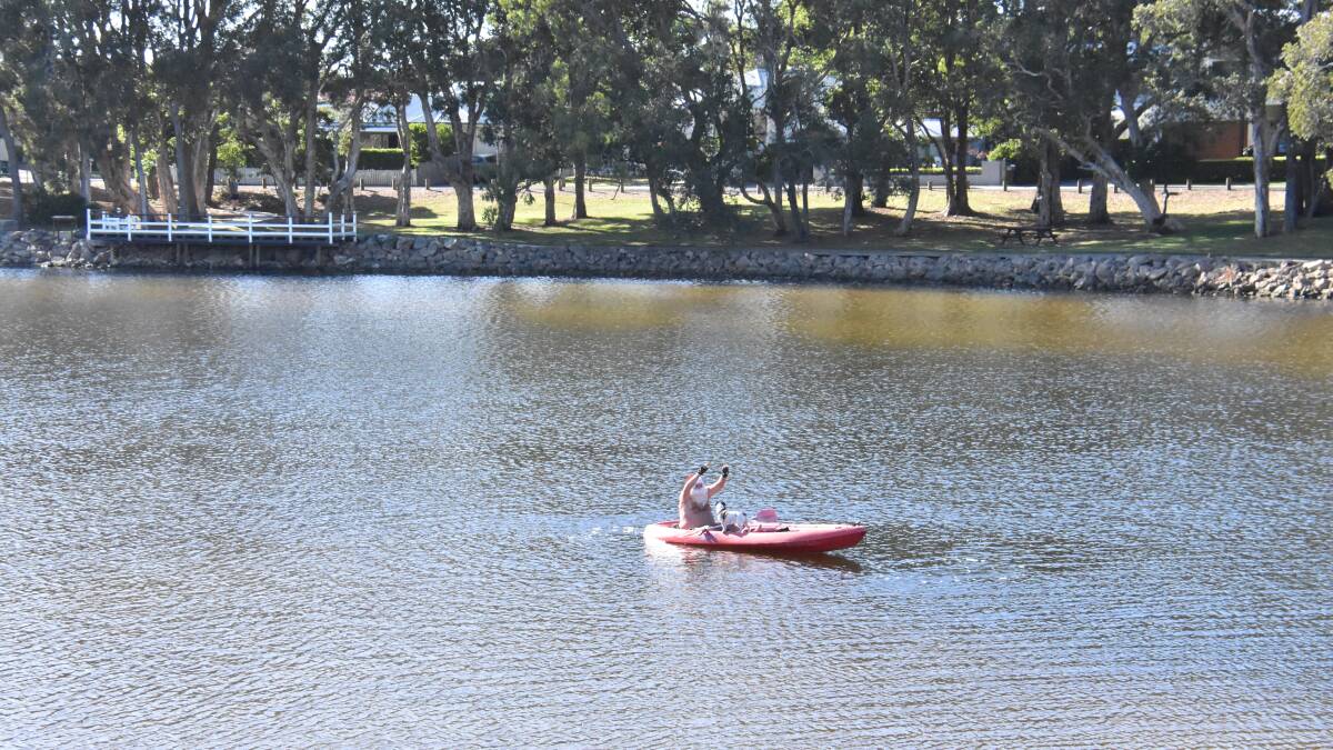Kayaking Santa brings festive fun to Lake Cathie
