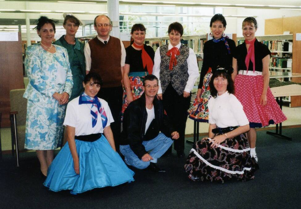 Dress up: Port Macquarie Library staff in 2001. Photo: supplied. 