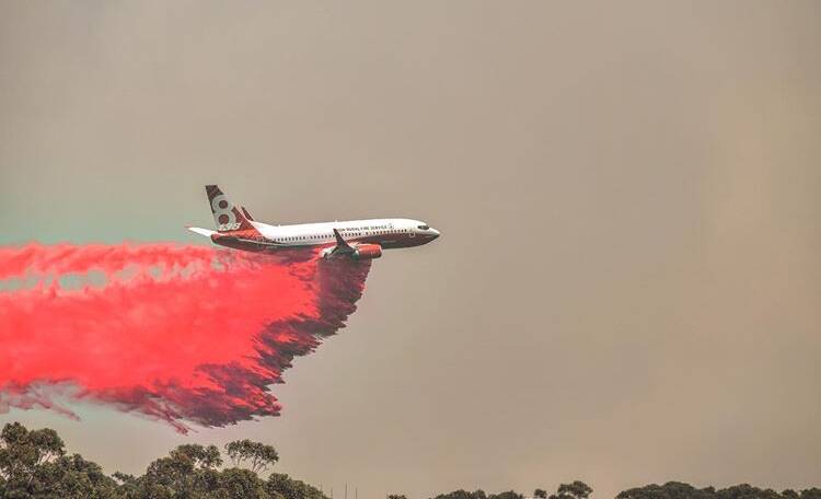 Fire suppressant retardants are dropped from aircraft during firefighting operations. Photo credit: Brittany Daly