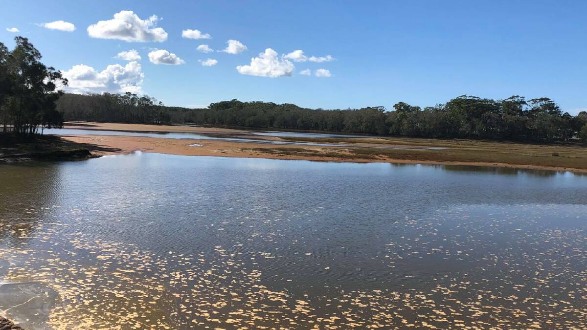 Investigation underway after water turns red at Lake Cathie