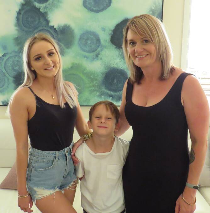 Jess with her brother Ashton and mum Rochelle. 