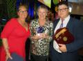 Wayne Jackson's wife Rebecca and son Will presented the 2021 Wayne Jackson Outstanding Community Service Award award to Sandra Slattery. Photo: Liz Langdale. 