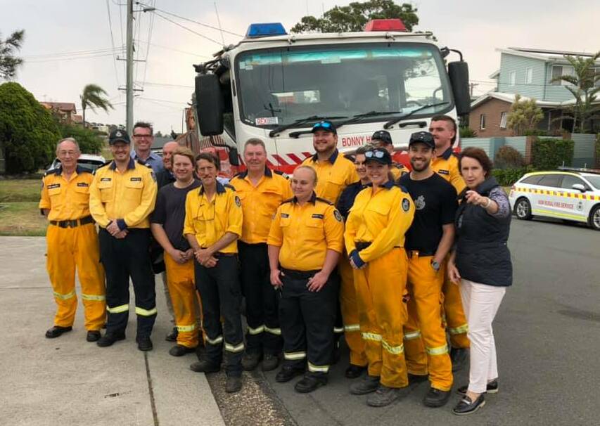 Massive effort: Members of the Bonny Hills Rural Fire Brigade members with Emergency Services Minister David Elliott, NSW Treasurer Dominic Perrottet, NSW RFS Commissioner Shane Fitzsimmons and Member for Port Macquarie Leslie Williams. Photo: Bonny Hills Rural Fire Brigade. 