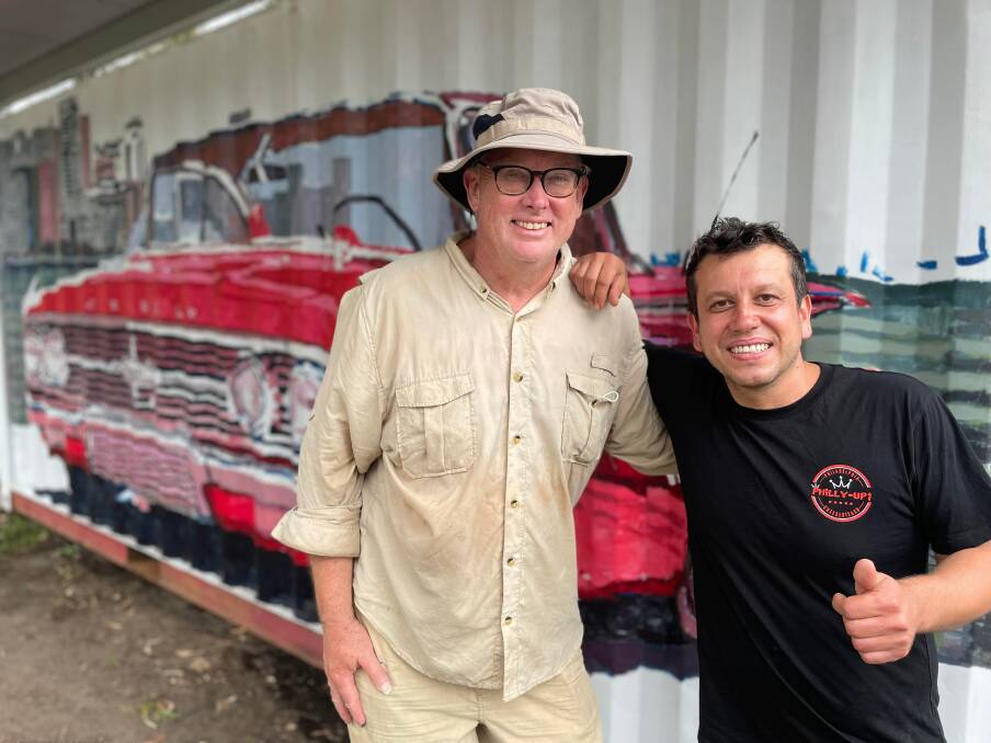 Bold and beautiful: Artist Max Hillier with Philly Up business owner Lui Isgorener and the mural of the 1954 Impala Chevrolet. 