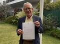Port Macquarie Historical Society president Clive Smith holds the letter confirming their Vice Regal Patronage. Picture by Liz Langdale 