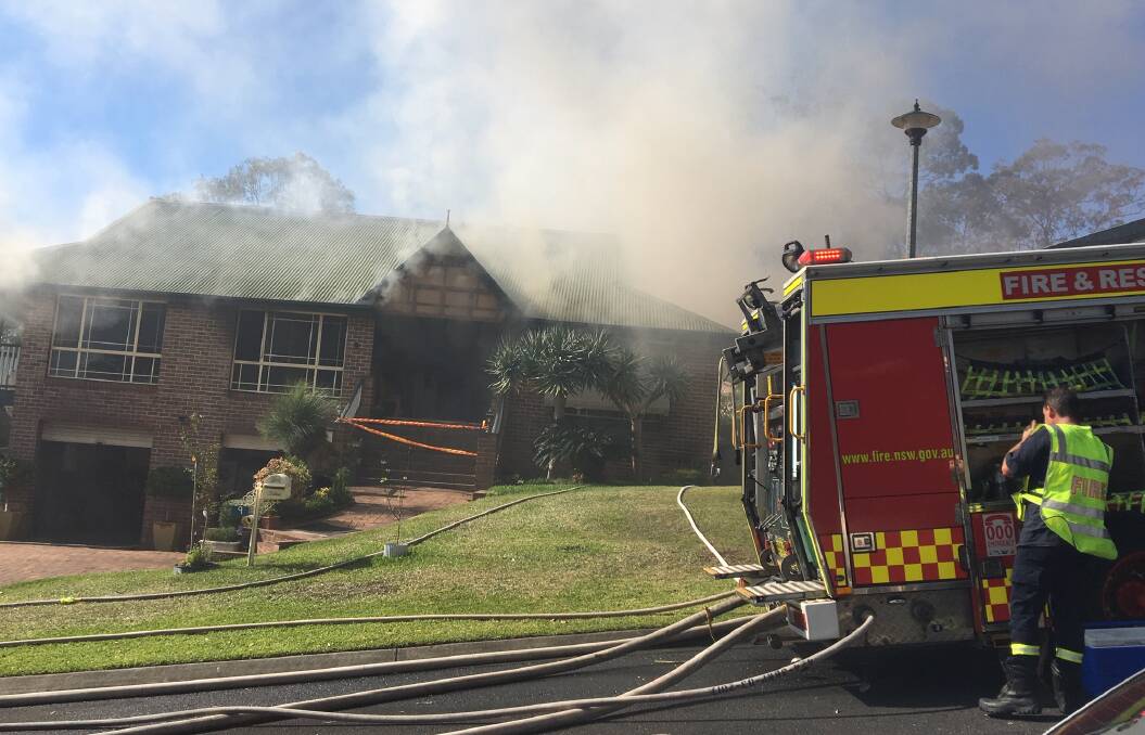 Residents and the property's devastated owners watched on as the firefighters worked to bring the blaze under control. Photo: Tracey Fairhurst. 