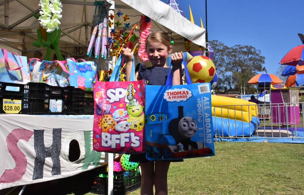 Kiera Ansell with an array of fun goodies at the 2019 Camden Haven Show. Picture by Chan Ansell