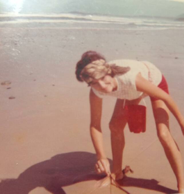 Lynne Leayr on the hunt for worms in front of the caravan park in the early 70s. Photo: Lynne Leayr. 
