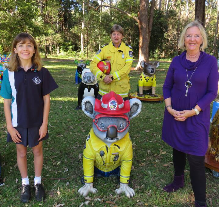 Community effort: Jessica Miles, Kingsley Searle from the NSW RFS and artist Kim Staples. 