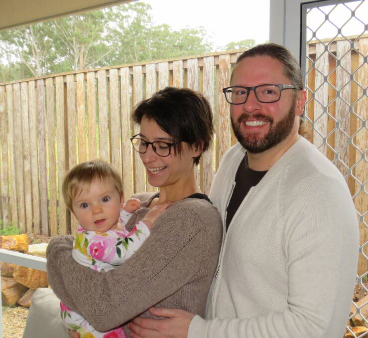 Smoke health concerns: Megan Adams and Dana Brestel with their baby daughter Maddy.