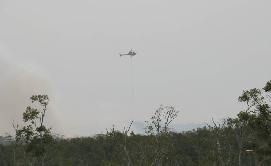 Helicopter assisting in the fire fighting effort near the Crestwood estate. 