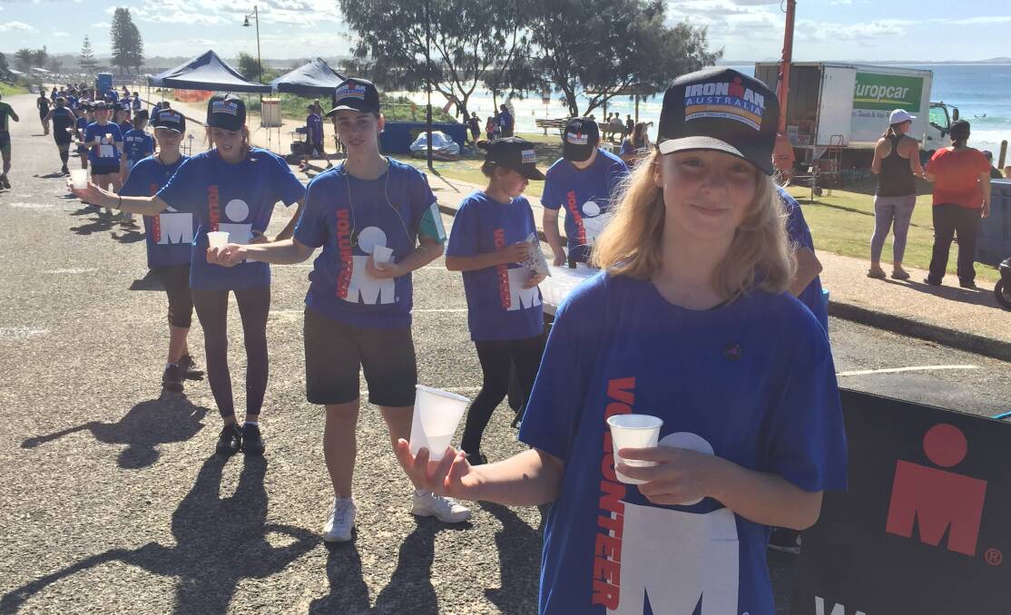 Thank you: Students including Keera Inglis from Hastings Secondary College gave up their Sunday to be at Ironman Australia. They kept the athletes hydrated and energised.