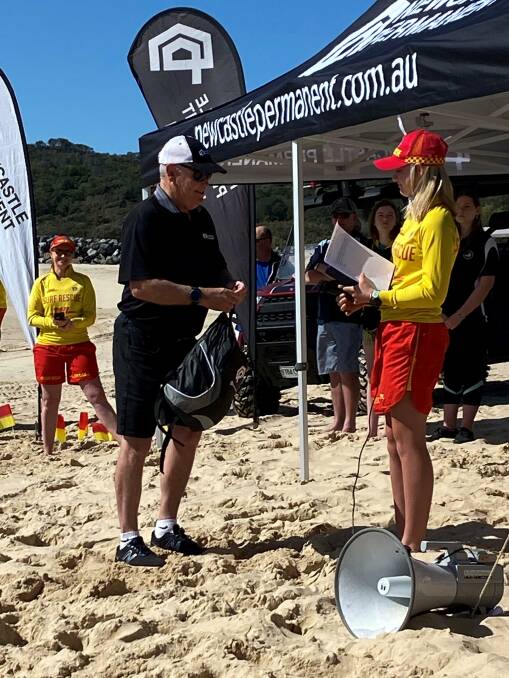 Bob Higham (NPBS) presenting MNC Junior Lifesaver of the Year award to Bronte McAlister (Tacking Point SLSC)