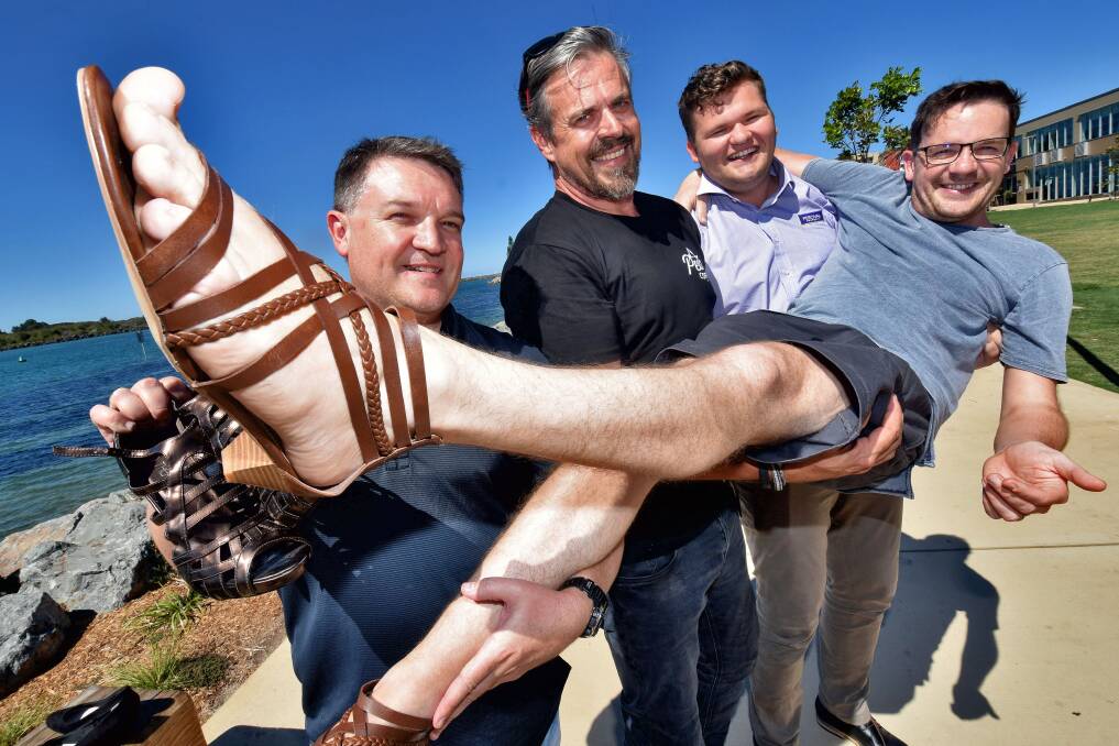 Stepping up: Richard McGovern, Westpac Rescue Helicopter Service; Steve Foye, Peak Coffee; Michael Wilkie and Michael Percival, Percival Property and Ollie Brooke, Cloud Concepts don the heels to raise awareness about domestic violence and gender equality. Photo: Matt Attard.
