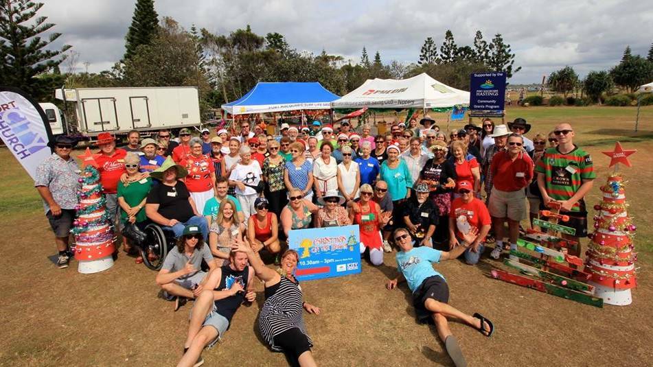 Please help: More than 200 volunteers band together to bring Christmas on the Beach to Port Macquarie every year.