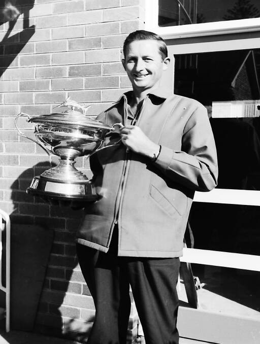 Angling Club President, Kevin Bramble holds the Bitewell Bait trophy won at the State Championships, 1969.