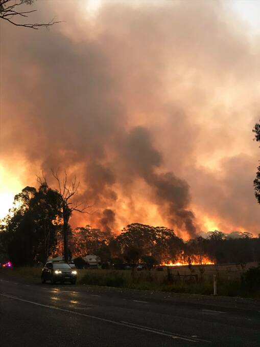 Still burning: The Lindfield Park Road fire came close to Hastings River Drive earlier this week. Photo: Cara Langby.