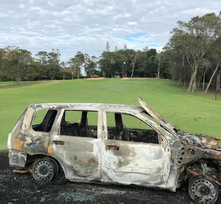 The stolen and burned out car at Port Macquarie Golf Club.