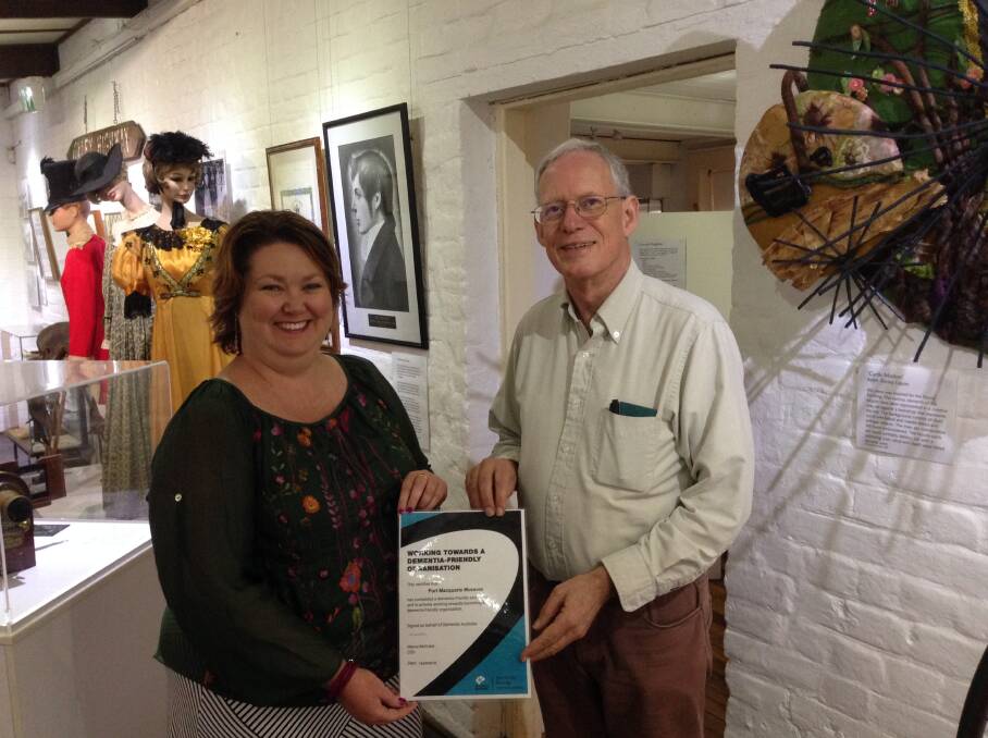 Kara Nicholson presents Clive Smith with the Port Macquarie Museum's Working Towards Dementia Friendly certificate. 