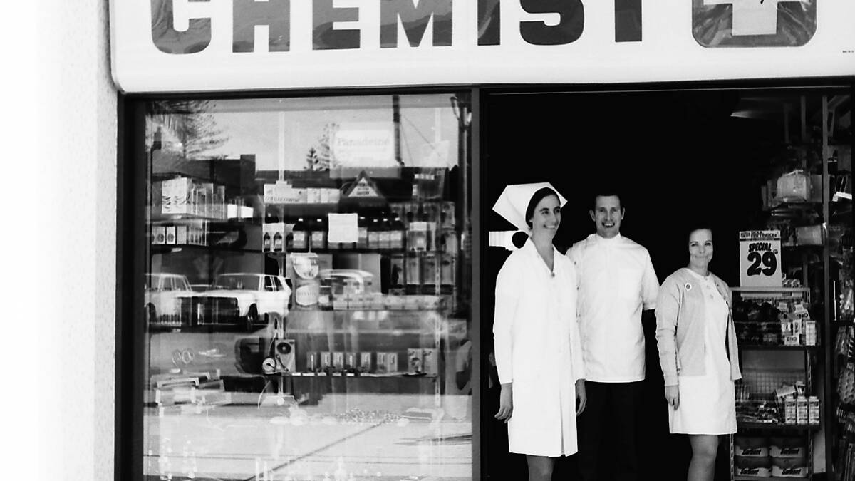 Mrs and Mrs Baker and their assistant Mrs. Penny Hesse in front of the new chemist shop, 1969.