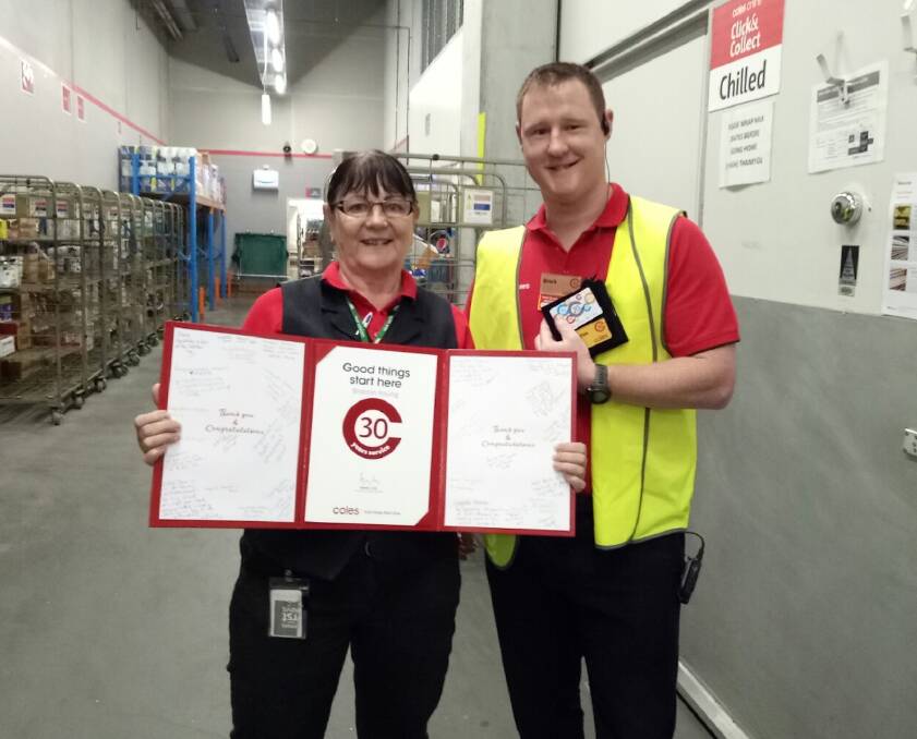 Milestone: Coles Lake Innes employee Sharron Young with manager Brock Mackay.