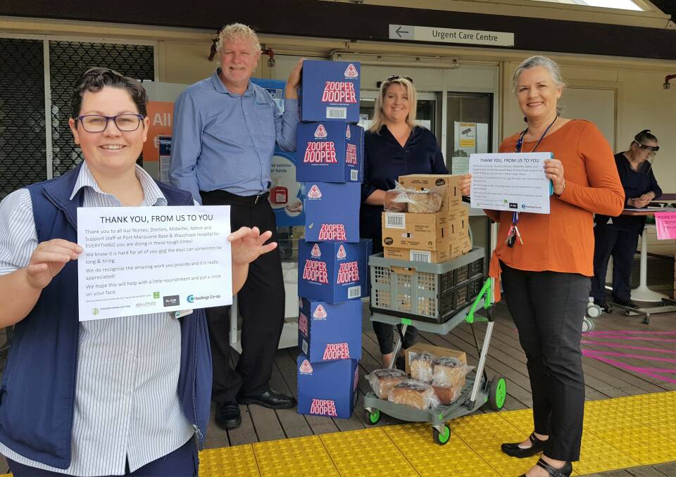 Kind donation: Tim Walker of Hastings Co-op and Rebecca Stockwell deliver banana bread, Zooper Doopers and juice to Wauchope District Memorial Hospital staff. Ready to thank them were Kathy Boom, Acting Nurse Manager, and Ann Bodill, Director of Nursing/Executive Officer.