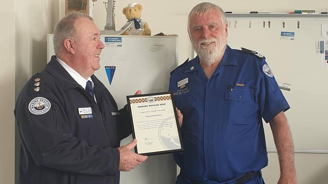Reg McGlashan receives his National Service medal for 20 years' service with Marine Rescue.