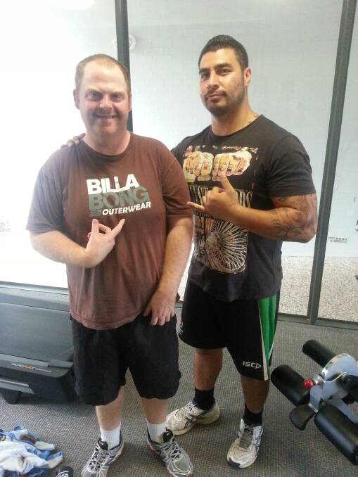 Fitness fan, Sam Frumar with John Talamaivao, Disability Support Worker with Centacare’s Individual Support Options Program.
