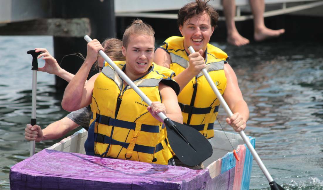 Students compete in the inaugural Cardboard Boat Regatta.