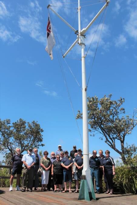 The White Ensign is raised on the 25th anniversary of the decommissioning of HMAS Nirimba.