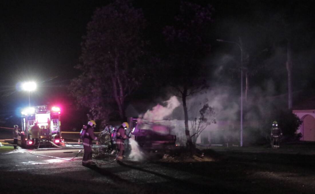Fire crews extinguish the blaze involving a car and an electrical sub-station. Photo: Jordan Frith.