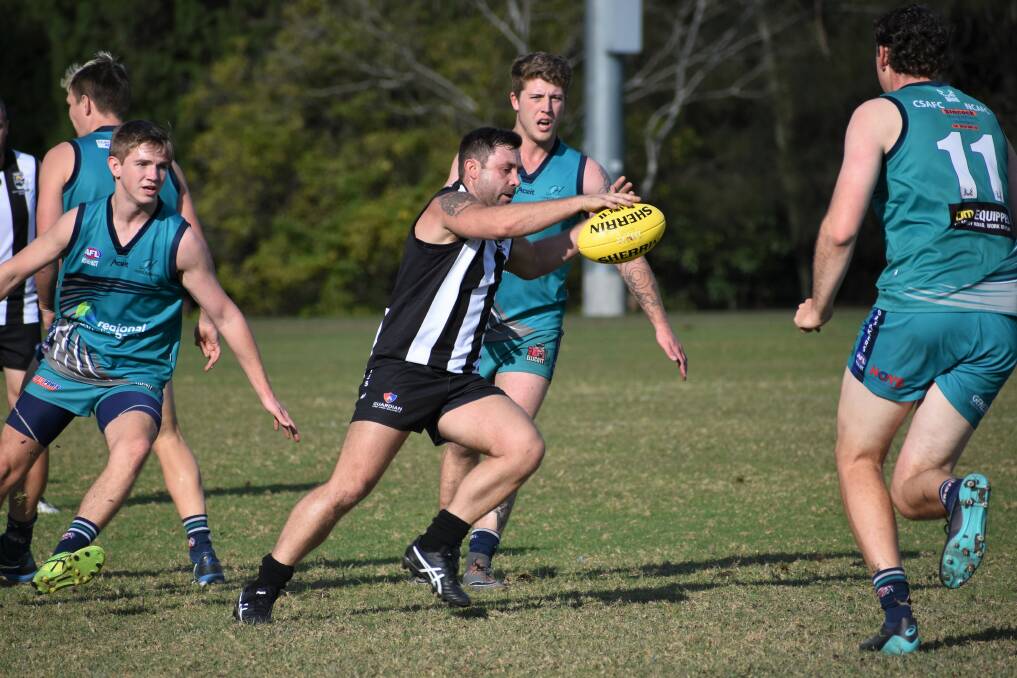 On the run: The Magpies worked hard against a tough Coffs Harbour line-up on Saturday. Photo: Green Shoots Marketing.