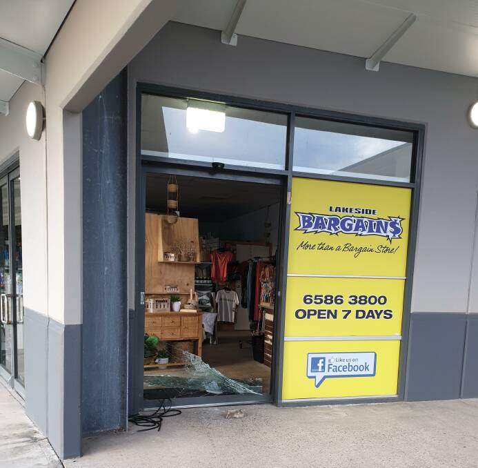 Vandals smashed the front glass door to Lakeside Bargains in Lake Cathie. Photo: Supplied.
