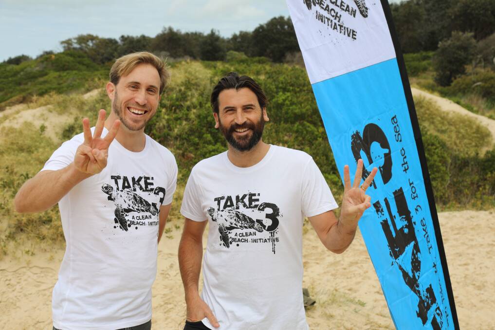 Share a message: St Columba Anglican School secondary teacher Chris Tejcek with co-founder of Take 3 For the Sea campaign Tim Silverwood at Lighthouse Beach.