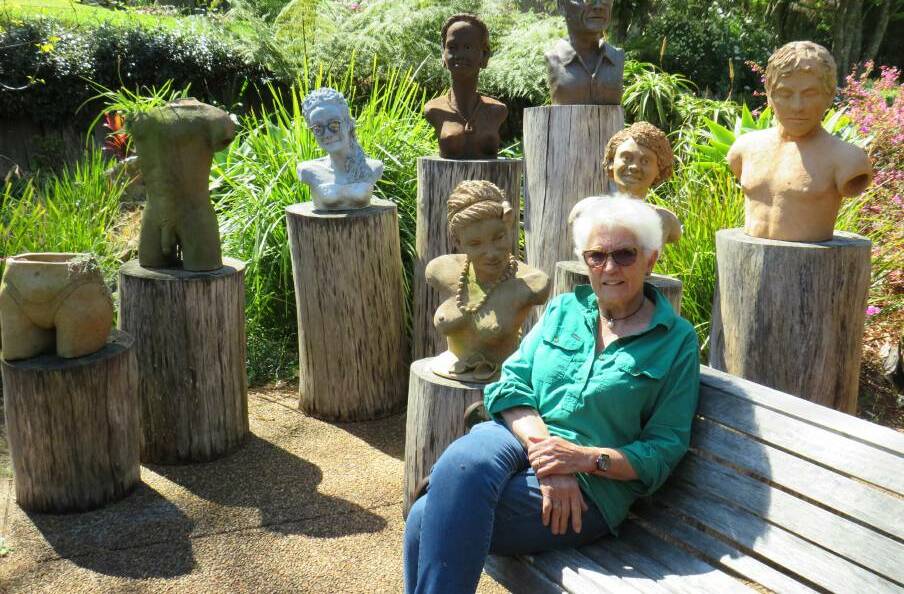 Nola Stumm with some of her sculptures on display in her garden.