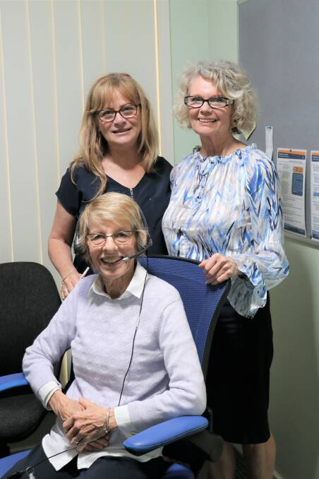 Catherine Clarke and Alexis Williams, telephone crisis support team members, with Fran Bec, a volunteer telephone crisis supporter.