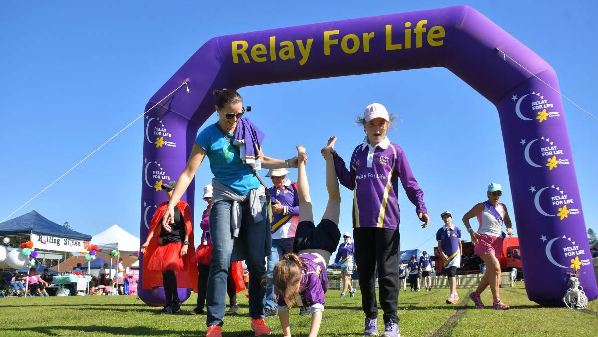 FUN TIMES: At the 2018 Relay for Life in Port Macquarie - Carol Baker, Charli Miller and Jordyn Miller have an unconventional way of walking around the track.
