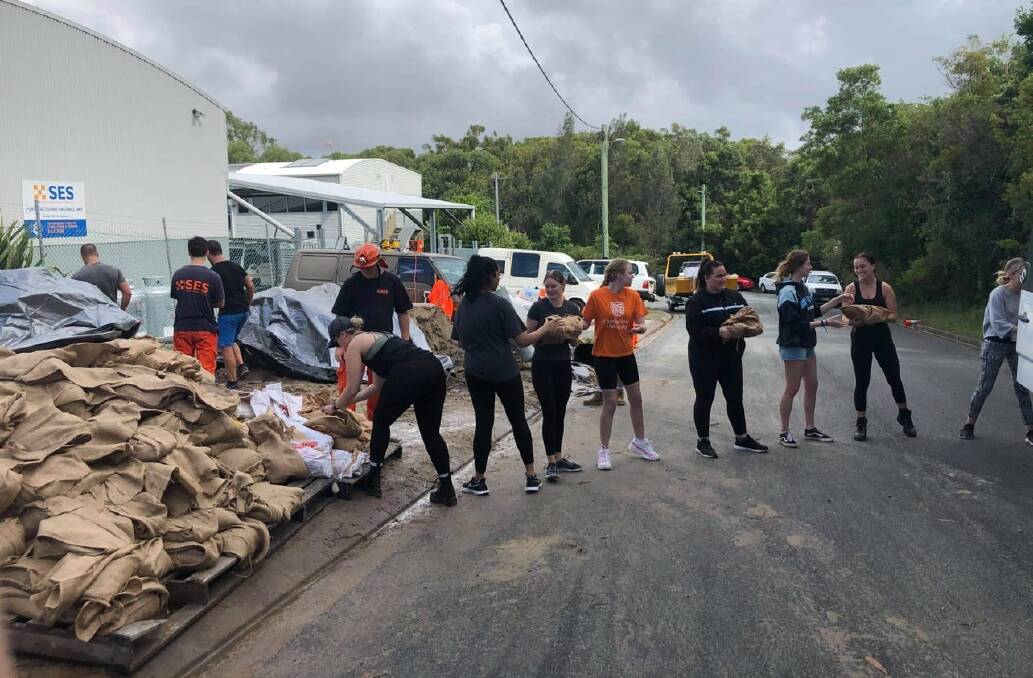 Charles Sturt University students assist with the flood effort. Photo: CSU Port Macquarie.