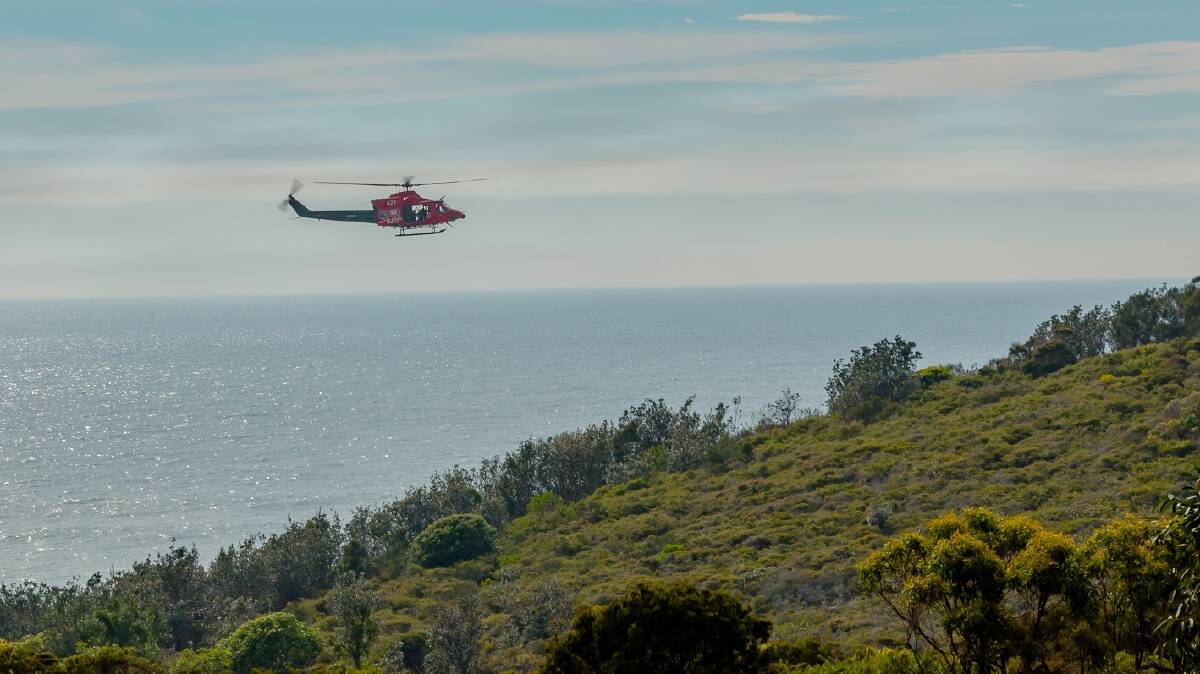 Westpac Rescue Helicopter continues the search from the air south of Port Macquarie. Photo: Glyn Jones.