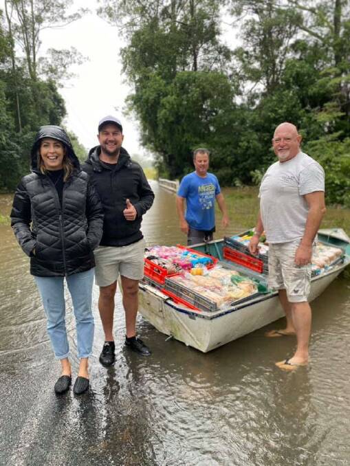 Delivery: Port Anglican Soup Kitchen's Kristie Arnold with Self Seen's Ben Cudmore and volunteers deliver supplies to flood-affected families.